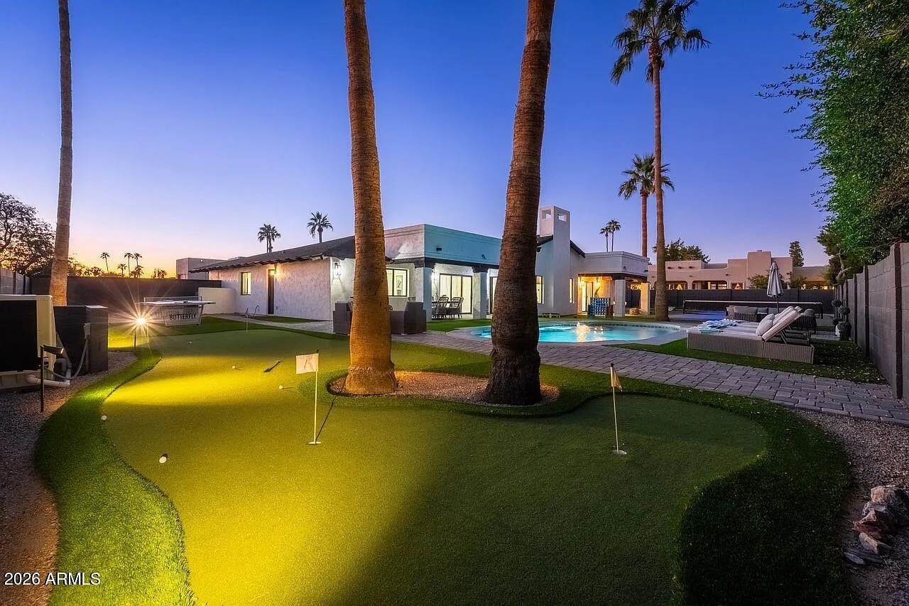 Five-hole putting green lit at sunset