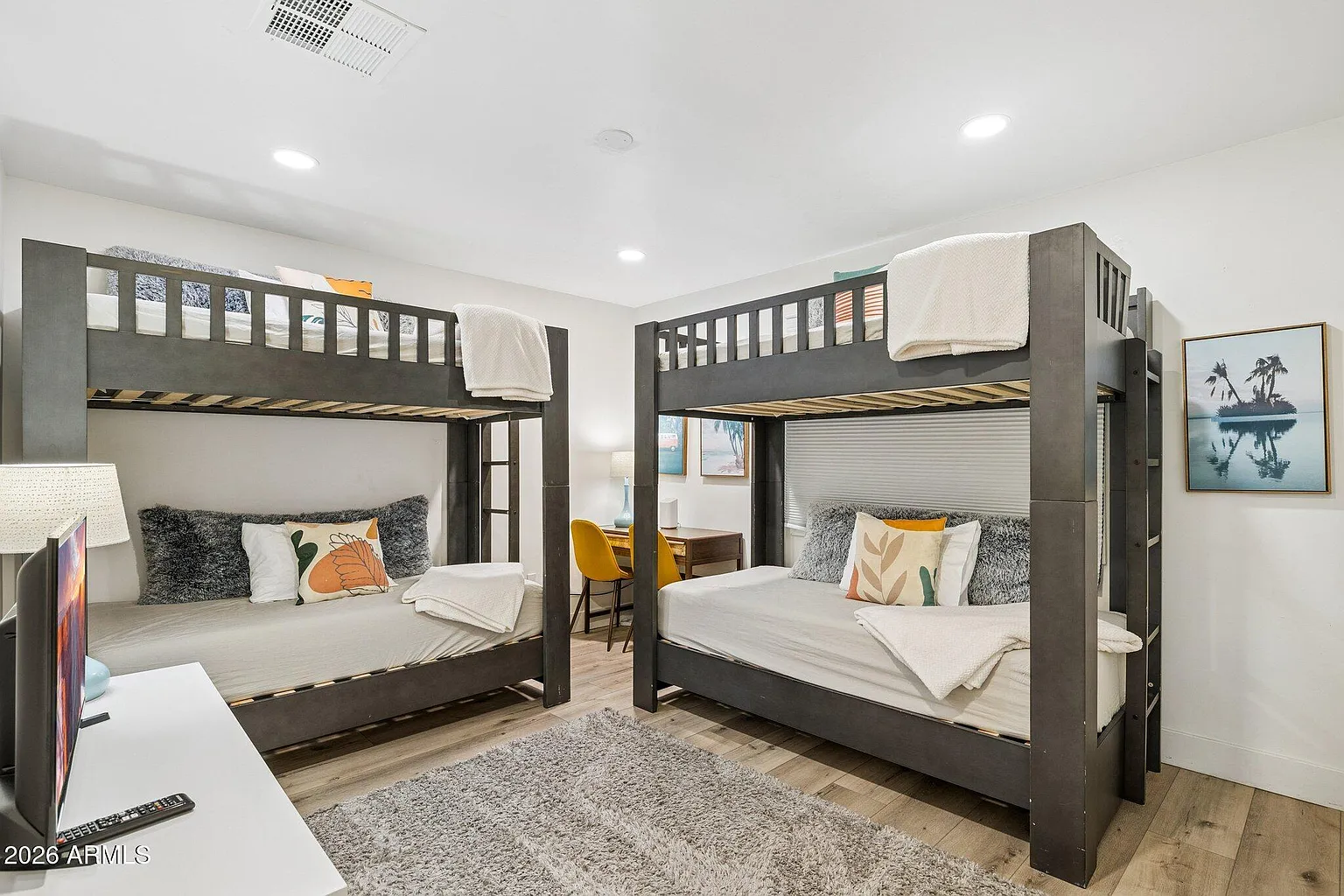 Bunk room with two double-over-double bunks