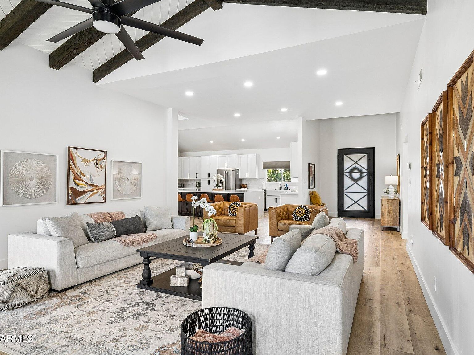 Open living room with vaulted beamed ceilings